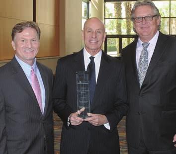Brad Prechtl, CEO of Florida Cancer Specialists, and founder and president Dr. William Harwin accepted the award at AmerisourceBergen s annual manufacturer summit in Orlando.