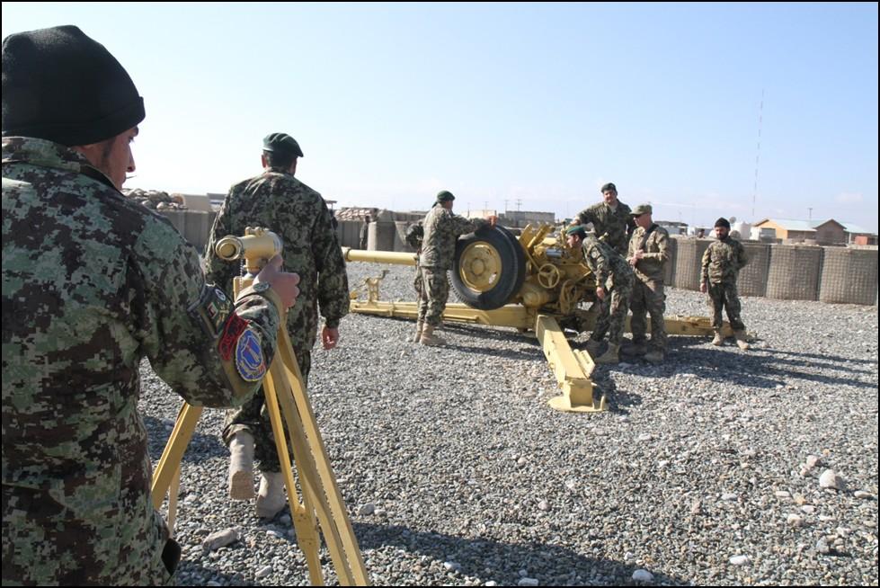(ABOVE) Afghan National Army artillerymen from Field Artillery Coy, 4th Kandak, 4th Brigade, 203rd Corps, conduct training to speed up their firing capabilities on the Soviet 122 mm D-30 howitzer,