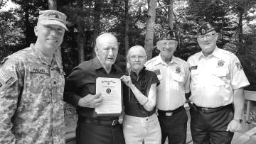 Left to right, Sgt.-at- Arms Steve Collins, Bill O Connell (hidden by US Flag), Bill Allen, Roland Rollie Weeman, Adjutant Bob Webber, Asst. Sgt.-at-Arms Jim Swol, and Cdr. Mike Doyle.