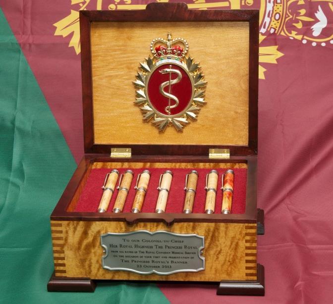 RCMS Commemorative Gift Presented to the Colonel-in-Chief Commemorative Pen Box The cover of this hand-made box