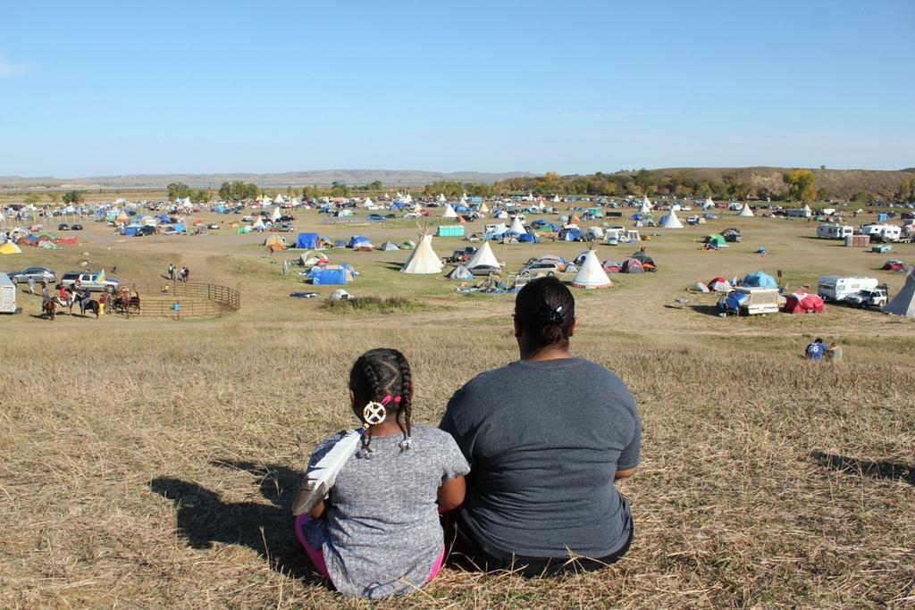 A Buder student and her daughter look out over one of the camps for water protectors. (Photo Credit: Becky Plumage) On September 8, St.