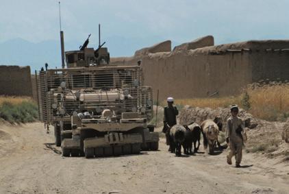 To help ensure the roads are safe to travel, a soldier with a counter-ied (C-IED) team moves through an Afghan village in the Pul-e-Alam district of Logar Province. LTG Michael A.