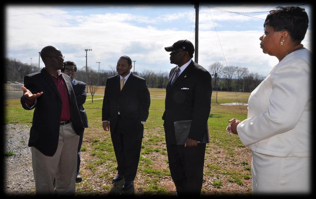 Long-Term Impact Alabama A&M University President touring a site approved for the installation of a green house for the new urban farming program at Butler High