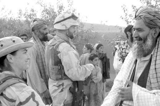 PSYOP and Civil Affairs soldiers visit a village near Kandahar, Afghanistan, September 2003.