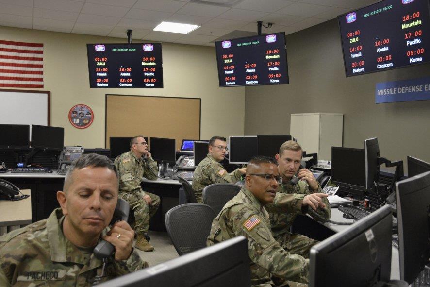 Soldiers from the 100th Missile Defense Brigade's C-crew train on the Ground-based Midcourse Defense system to shoot down incoming missile attacks (screens are blacked for security reasons).