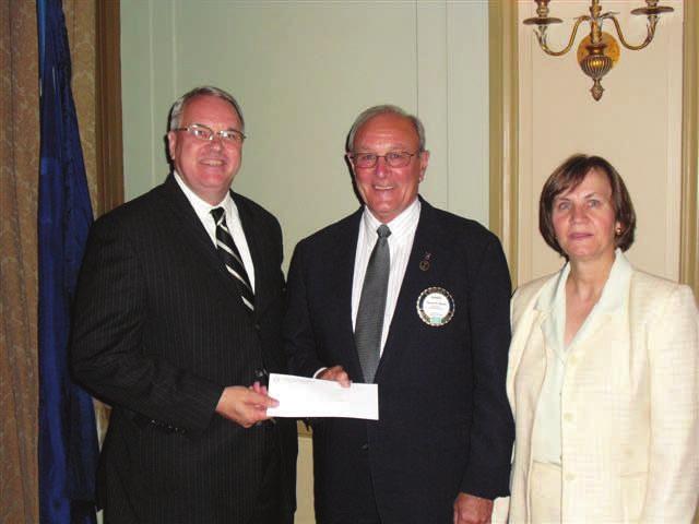 LOCAL AGENCIES RECEIVE NEEDED FUNDS Steve Hand, left, director of Quick Jobs for Greenville Technical College, received a check from Rotary Charities at the club's May 24th meeting, from Club