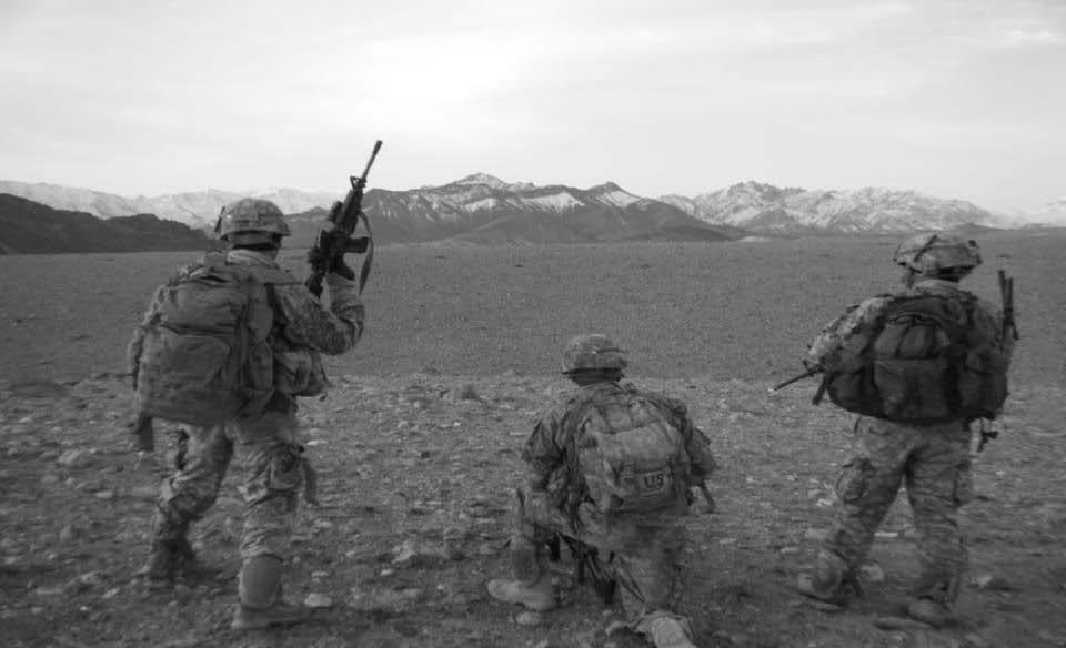 U.S. Army soldiers from 2nd Platoon, A Co, 1-503d Infantry Battalion, 173rd Airborne Brigade Combat Team (ABCT) pull security near Makhtum, Chak District, Wardak Province, Afghanistan, 10 March 2010.