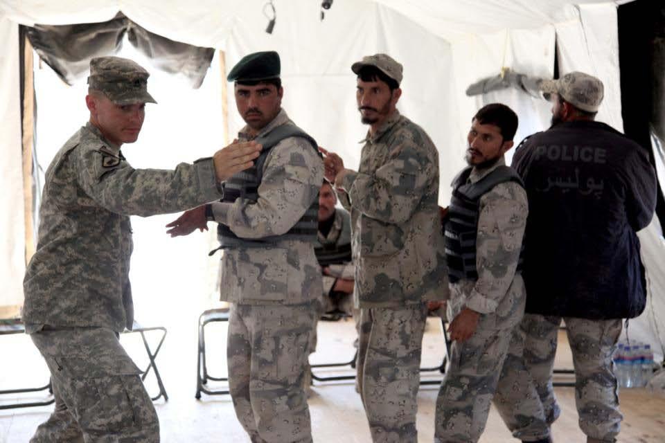 Afghan Border Police personnel practice room clearing procedures during training given at Forward Operating Base
