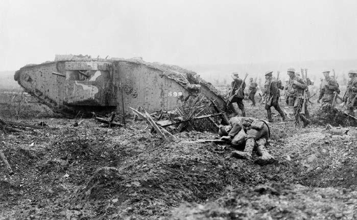 Canadian troops advancing with a British Mark II tank at the