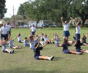 NEWS/FEATURES Air Force PT in the community Nobody rocks until comm rolls Courtesy Photo Members of the 6th Communications Squadron teach children from Saint Anthony Catholic School how to do pyramid