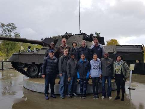 Members posing with a Leopard 1 Main Battle Tank of the Royal Netherlands Army on display at the National Military Museum.