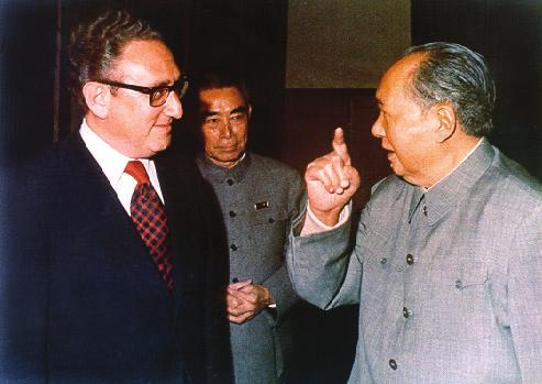 decision to normalize relations with Beijing. In this photograph, they are greeted by Georgetown President Timothy S. Healy, S.J.