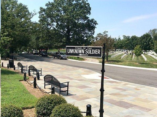 Page 6 of 14 Sign points to the venerable Tomb of the Unknown Soldier. Strict silence must be maintained in this area of Arlington National Cemetery.