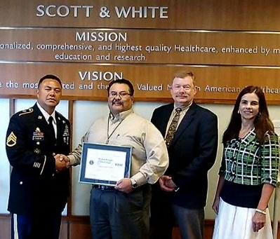 com/tx_esgr Supervisor Given Award IRS Presented with Above and Beyond Raymond Rodriguez, a supervisor with Scott & White, is given a