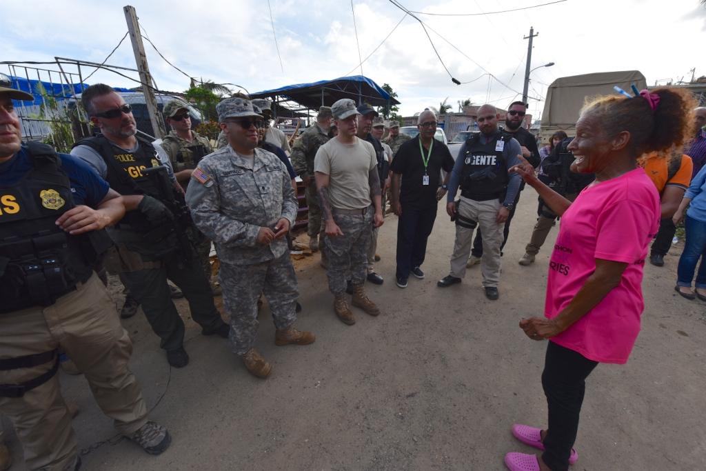 A community member thanks the Coast Guard, FEMA, Army and Puerto Rico Hacienda after they delivered food and water to more than 400 residents in Canovanas, Puerto Rico, Oct. 17, 2017.
