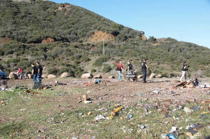 The site was littered with trash, broken glass and discarded appliances.