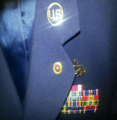 Wear button(s) center on left lapel of the mess dress coat and even with top row of medal(s). 4.16. Next of Kin Lapel Button. In accordance with 10 U.S.
