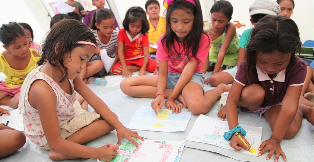 NEED MORE INFORMATION? UNICEF/NYHQ2014-0254/Pirozzi Children colour in a child-friendly space in the barangay of San Jose, Philippines.