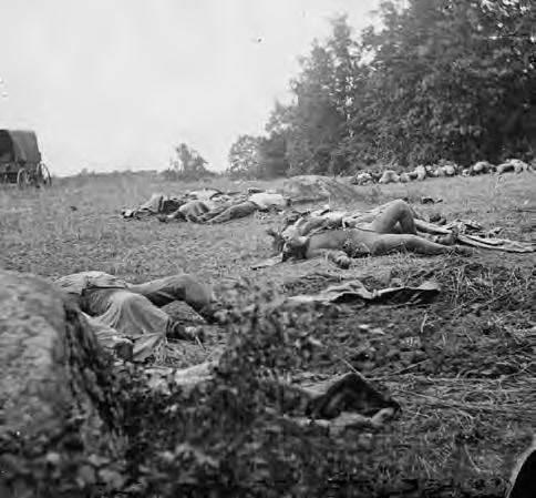 CW3.4.8 Civil War Battle Stations Gettysburg (July 3, 1863) Gettysburg, Pa. Confederate dead gathered for burial at the edge of the Rose woods, July 5, 1863. Source: Library of Congress: http://www.