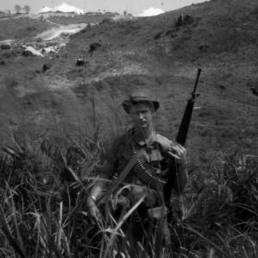 Patrol near Vung Chua Mountain A soldier in tall grass on patrol.