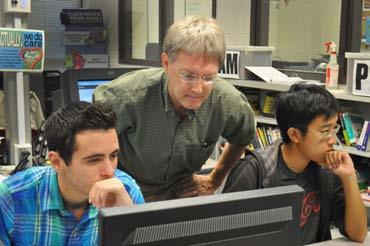 student Derek Huynh (right) as they work on their interactive web page designs. Interactive Media is a new course offered this year at Maxwell High School of Technology.