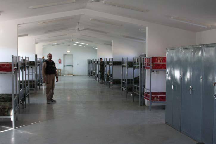 The gymnasium s insulation and interior finishes were in place and installed in accordance with the contract. Photo 2: Barracks at Farah ANA Garrison Source: SIGAR, January 11-14, 2010.