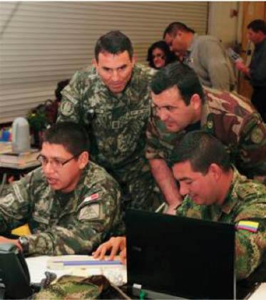 Military officers from Peru, Paraguay and Colombia work alongside one another during PANAMAX 2012 at Fort Sam Houston, Texas. [MASTER SGT. KEVIN DOHENY/U.S. ARMY] Col.