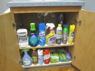 SINK Items under sink should be stored neatly in DESCENDING height order from LEFT to RIGHT White paper on shelves under sink Water