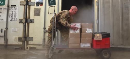 USAF photo by SSgt. Vernon Young Jr. MSgt. Patrick Noppenberg, an NCOIC of food services at Kandahar AB, Afghanistan, organizes supplies for a kitchen that provides some 1,500 meals per day.