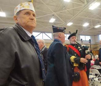 Director Art Griffith Piper pipes veterans to seats at Port Angeles, WA Veterans Day observance