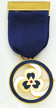 Gold-filled and enamel medallion on grosgrain ribbon. Safety catch closure. Made in USA. 09920. $110.00.