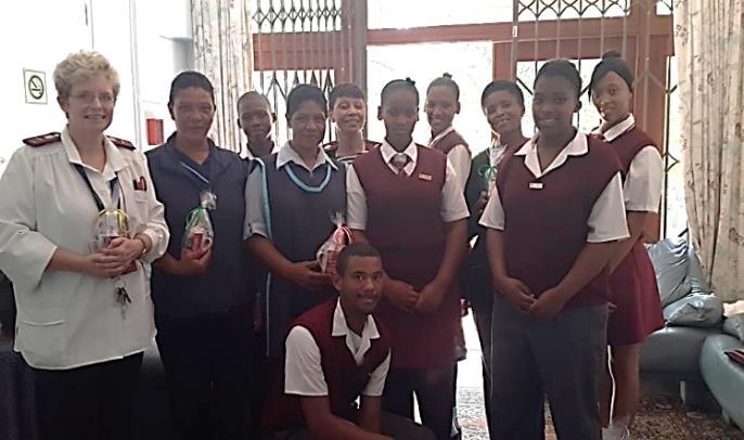 Left: Laerskool Stellenbosch pupils hand over the