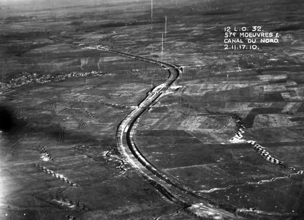 Sains-lez-Marquion Moeuvres Taken nearly a year before the battle (2 November 1917) this oblique air photo shows the dry bed of the Canal du Nord as it snakes past Moeuvres towards Sains-lez-Marquion.