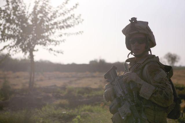 Boyd, a squad automatic weapon gunner with Echo Company, 2nd Battalion, 6th Marine Regiment, checks on his