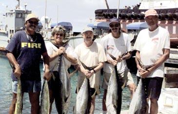 Bowling Scores What a catch Boat captain Danny Maning, Tish Kuskulis, George Brown, Billie Mewbourne, and Rod Dixon (left to right) hauled in about 300 pounds of fish after spotting a bird pile about