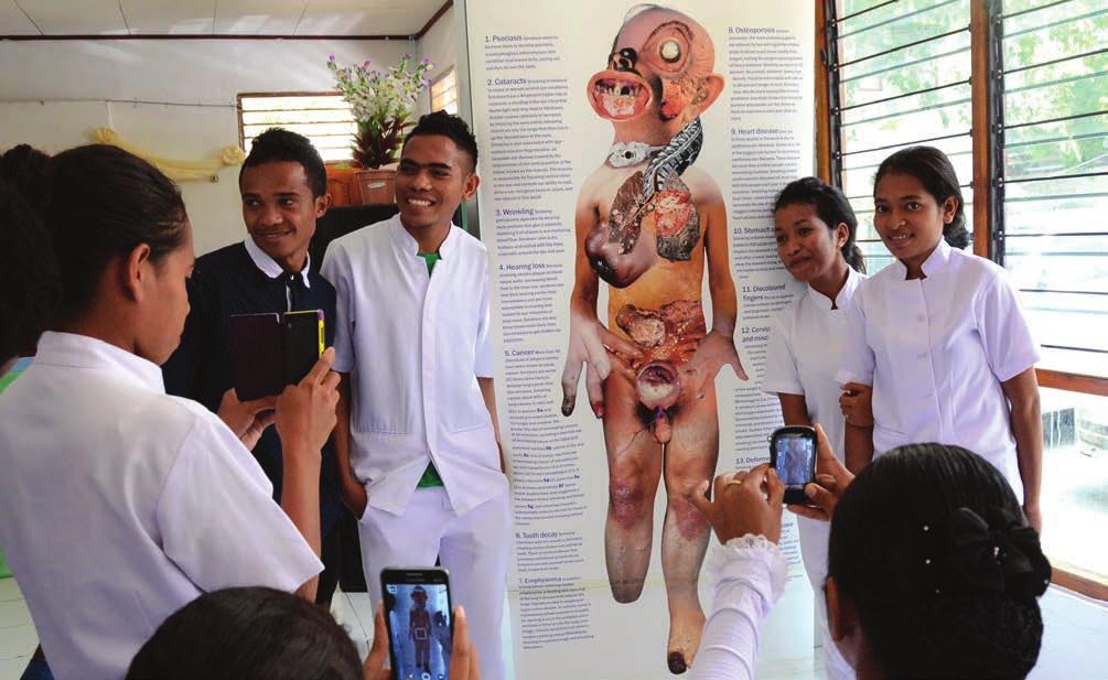 WHO/Karen Reidy Students by the Smoker s Body standee after the Anti-Tobacco Campaign launch at the UNTL by WHO and MoH on January 26, 2015. Table 1.