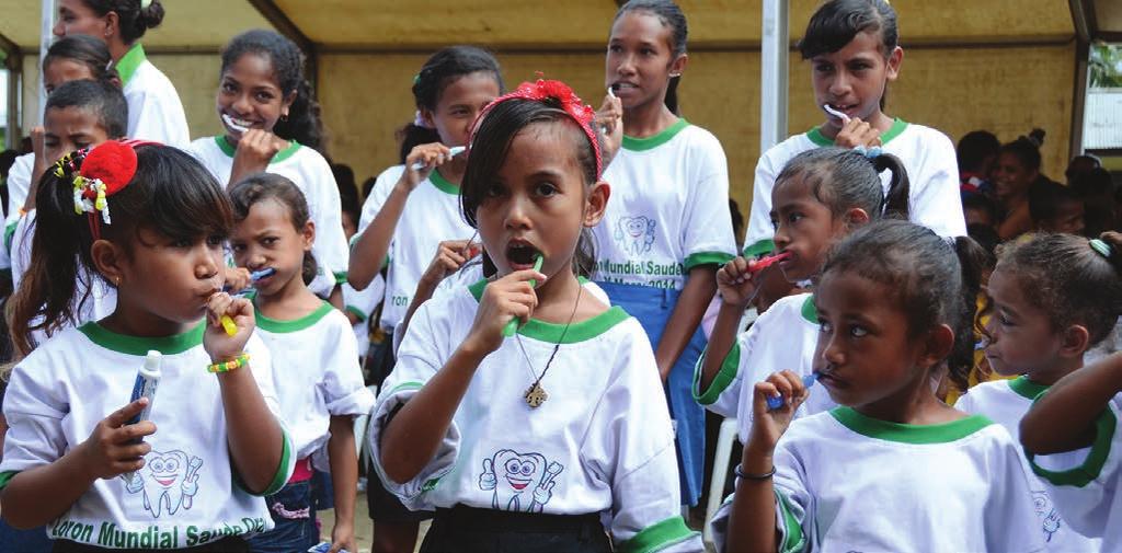 WHO Children receive free toothbrush and toothpaste at the launch of the School Oral Health programme in Dili March 20, 2014.