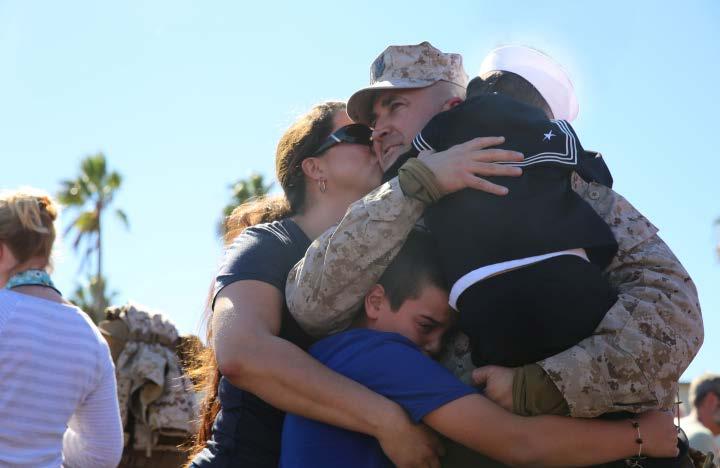 CAMP PENDLETON, Calif. - The crowd cheered clapped and all camera shutters clicked and clacked as buses filled with loved ones came to a stop next to the 21 Area parade deck.