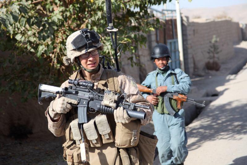Cpl. Michael Creighton, a team leader with the Police Mentoring Team, 3rd Battalion, 5th Marine Regiment, walks during a security patrol with the local Afghan uniformed police, Nov. 21.