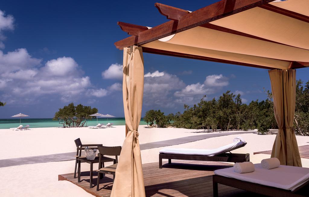 HOTEL INFORMATION Overlooking the Caribbean Sea with miles of azure waters to explore, experience, surprise and delight at every turn is the Ritz-Carlton, Aruba, one of the newest Aruba luxury hotels