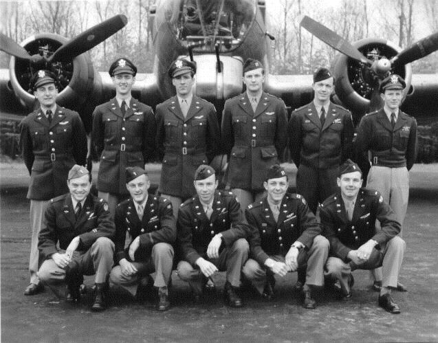 Standing Left to Right second from left is Lt. Leif R. Ostnes.