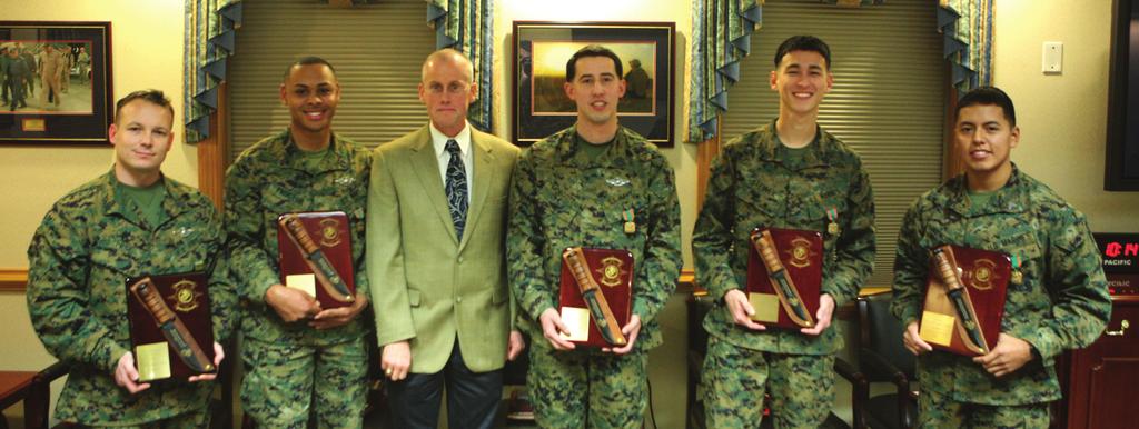 The Warrior s Log Page 2 Photo by (From left to right) Petty Officer 1st Class Raymond R.