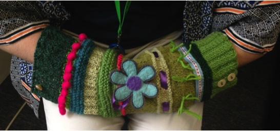 body of the knitting and to the cuffs, creating