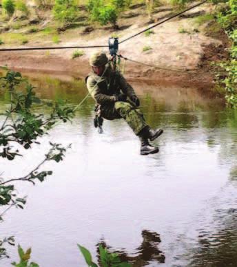 CAAWC 6 Platoon Advance Mobility Company A soldier from 6 Platoon ziplines across a stream during the Complex Terrain Instructor Course.