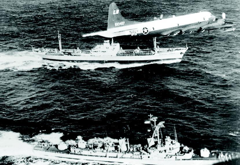 A VP 44 P 3A Orion flies over the Soviet ship Metallurg Anosov and U.S. destroyer USS Barry (DD 933) during the Cuban Missile Crisis.