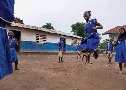 chapter two CHILDREN AND CHILD PROTECTION IN THE EVD RESPONSE Kenema, Sierra Leone - Ebola survivor playing in the court yard of her school.