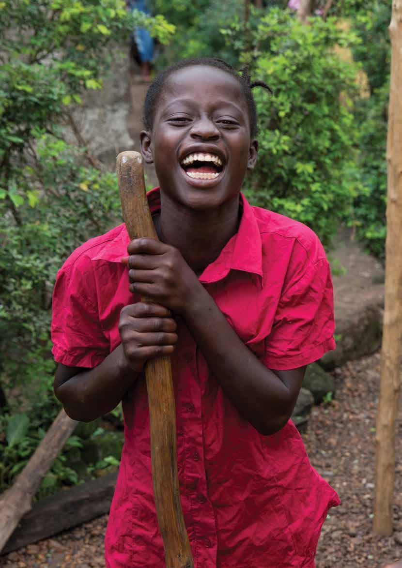 Acronyms Kenema, Sierra Leone - Ebola survivor outside her house.