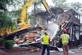 The building that served as the post s headquarters since 1941 is being demolished this week to make room for a park and amphitheater.