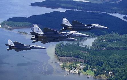 Staff photos by Guy Aceto Above and right, four-ship formations of F-15s from the 95th Fighter Squadron