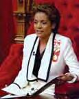 The Right Honourable Michaëlle Jean, CC, CMM, COM, CD, wearing her CD on a bow during the Speech from the Throne, 4 April 2006 Air Commodore Leonard Joseph Birchall, CM, OBE, DFC, OOnt, CD, receiving